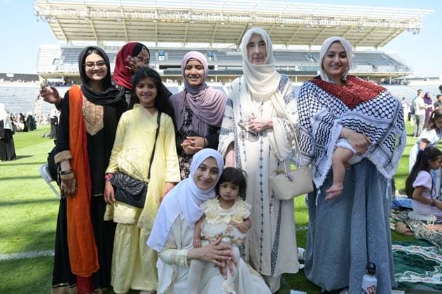 Mass Eid al-Adha gathering in Illinois BRIDGEVIEW, ILLINOIS - MAY 27: People pose for photos as thousands of Muslim worshippers gather on the field at SeatGeek Stadium for communal Eid al-Adha prayers on May 27, 2026, in Bridgeview, Illinois, United States. Organized by the Mosque Foundation, the annual outdoor celebration drew an estimated 20,000 attendees from across the Chicagoland area, marking it as the largest Eid gathering in the state. Jacek Boczarski Anadolu Illinois United States. Editorial use only. Please get in touch for any other usage.  Copyright: x2026xAnadoluxJacekxBoczarskix