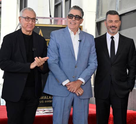 Comedy, actor, radio personality and television host Adam Corolla (C) is joined by Dr. Drew Pinsky (L) and Jimmy Kimmel during an unveiling ceremony honoring him with the 2,846th star on the Hollywood Walk of Fame in Los Angeles on Wednesday, May 27, 2026.  LAP2026052703 JIMxRUYMEN