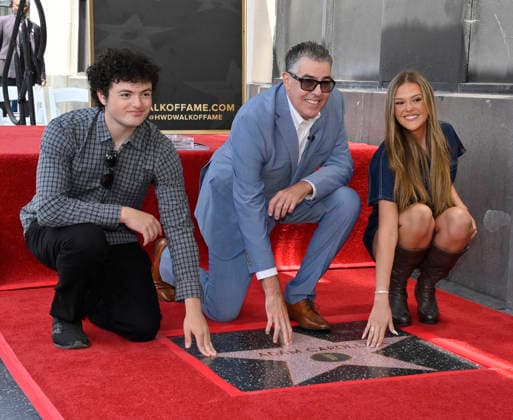 Comedy, actor, radio personality and television host Adam Corolla is joined by his son Santino Richard Carolla (L) and daughter Natalia Carolla during an unveiling ceremony honoring him with the 2,846th star on the Hollywood Walk of Fame in Los Angeles on Wednesday, May 27, 2026.  LAP2026052711 JIMxRUYMEN