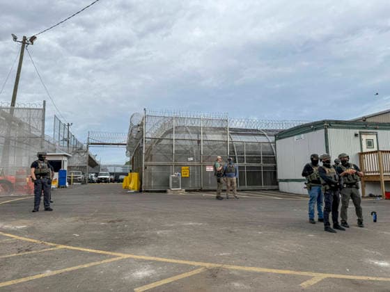 May 27, 2026, Newark, New Jersey, USA: Several ICE agents wearing bullet-proof vests stand outside of Delaney Hall ICE detention center as detainees inside continue their hunger and labor strike over inhumane conditions and due process violations. Supporters of the detainees are nearby. Newark USA - ZUMAd155 20260527_znp_d155_007 Copyright: xSuexDorfmanx