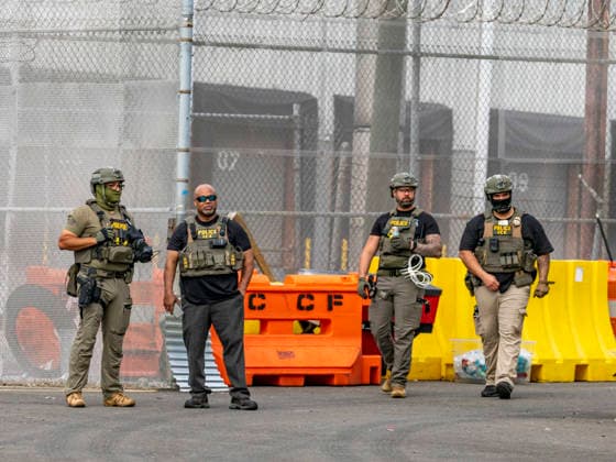 May 27, 2026, Newark, New Jersey, USA: ICE agents wearing bullet-proof vests stand outside of Delaney Hall ICE detention center as detainees inside continue their hunger and labor strike over inhumane conditions and due process violations. Supporters of the detainees are nearby. Newark USA - ZUMAd155 20260527_znp_d155_009 Copyright: xSuexDorfmanx