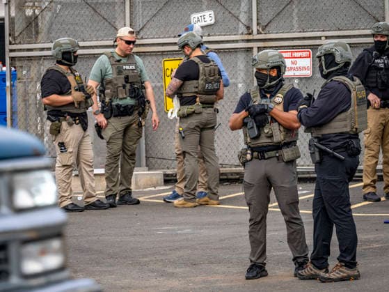 May 27, 2026, Newark, New Jersey, USA: ICE agents wearing bullet-proof vests stand outside of Delaney Hall ICE detention center as detainees inside continue their hunger and labor strike over inhumane conditions and due process violations. Supporters of the detainees are nearby. Newark USA - ZUMAd155 20260527_znp_d155_011 Copyright: xSuexDorfmanx
