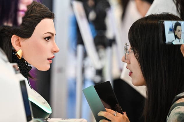 (260528) -- TIANJIN, May 28, 2026 -- A visitor interacts with a humanoid robot at the World Intelligence Expo 2026 in Tianjin, north China, May 28, 2026. Themed Intelligence: Extensive Development Space, Sustainable Growth Driver, the World Intelligence Expo 2026 kicked off here on Thursday. ) CHINA-TIANJIN-WORLD INTELLIGENCE EXPO (CN) ZhaoxZishuo 