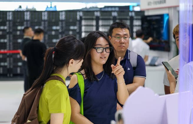 (260528) -- TIANJIN, May 28, 2026 -- A visitor tries an AI-powered translation glasses at the World Intelligence Expo 2026 in Tianjin, north China, May 28, 2026. Themed Intelligence: Extensive Development Space, Sustainable Growth Driver, the World Intelligence Expo 2026 kicked off here on Thursday. ) CHINA-TIANJIN-WORLD INTELLIGENCE EXPO (CN) SunxFanyue 