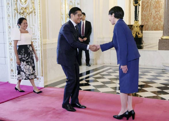 Japan-Philippines summit Japanese Prime Minister Sanae Takaichi (R) greets Philippine President Ferdinand Marcos Jr. and his wife Louise Araneta-Marcos at the State Guest House in Tokyo on May 28, 2026. (Pool photo)  A14AA0005617052P