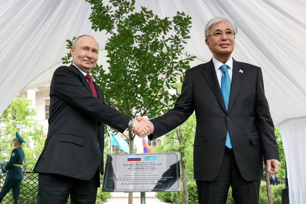 KAZAKHSTAN, ASTANA - MAY 28, 2026: Russia s President Vladimir Putin (L) and Kazakhstan s President Kassym-Jomart Tokayev shake hands during a tree-planting ceremony on the Alley of Eternal Friendship between Russia and Kazakhstan. Alexander Kazakov Russian Presidential Press and Information Office TASS  93130579