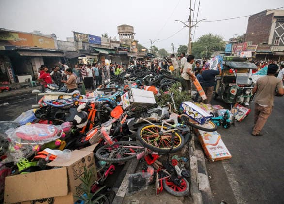 A massive pile of children™s bicycles, tricycles, and toys lies scattered on a roadside after being hastily evacuated Amritsar, May 28 (ANI): A massive pile of children™s bicycles, tricycles, and toys lies scattered on a roadside after being hastily evacuated from a nearby shop following a major fire breakout in a Rambagh market, in Amritsar on Thursday. One man died. Amritsar Punjab India Copyright: xANIx ANI_20260528516