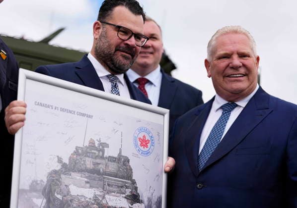 May 28, 2026, Ottawa, On, CAN: An Ontario made logo is shown on a signed poster from General Dynamics Land Systems-Canada s (GDLS-C) Dave Haggerty as he presents it to Premier of Ontario Doug Ford, after a news conference at the Canadian Association of Defence and Security Industries annual defence industry trade show CANSEC, in Ottawa, on Thursday, May 28, 2026. Ottawa CAN  - ZUMAc35_ 20260528_zaf_c35_015 Copyright: xJustinxTangx