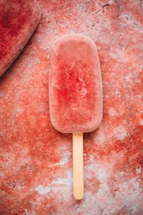 Raspberry popsicle on a red background Raspberry popsicle on a red background Copyright: xClaudiaxSilverstonex CS160426-3