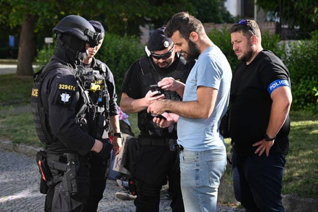 The situation in front of the District Court in Pardubice, where a custody hearing is underway with a man accused of intentionally setting fire to the LPP Holding hall, 28 May 2026, Pardubice, Czech Republic. Several supporters, including girls, came to support the detainee in front of the court building with Palestinian scarves and banners. Criminal investigators are accusing him of the crime of a terrorist attack and participation in a terrorist group. According to earlier reports, police have detained ten people in connection with this case. A fire broke out on March 20 in the production hall of the LPP Holding arms factory in Pardubice. The Earthquake Faction alleged anti-Israel group claimed responsibility for the fire. The group state  CTKPhotoP2026052807649