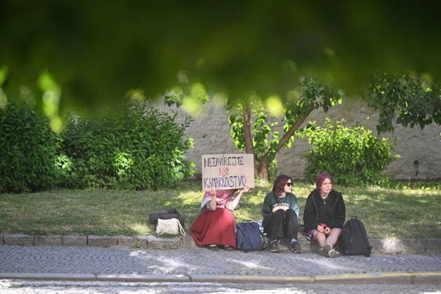 The situation in front of the District Court in Pardubice, where a custody hearing is underway with a man accused of intentionally setting fire to the LPP Holding hall, 28 May 2026, Pardubice, Czech Republic. Several supporters, including girls, came to support the detainee in front of the court building with Palestinian scarves and banners. Criminal investigators are accusing him of the crime of a terrorist attack and participation in a terrorist group. According to earlier reports, police have detained ten people in connection with this case. A fire broke out on March 20 in the production hall of the LPP Holding arms factory in Pardubice. The Earthquake Faction alleged anti-Israel group claimed responsibility for the fire. The group state  CTKPhotoP2026052807664