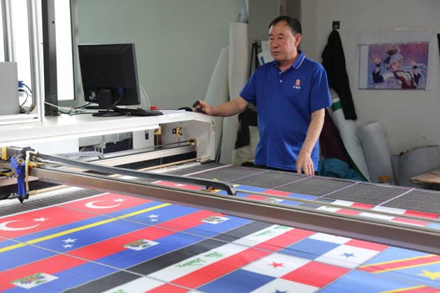 QINGDAO, CHINA - MAY 28: Workers are busy in front of an assembly line of flags for the FIFA World Cup at Qingdao Wonderful Flag Industry Co on May 28, 2026 in Qingdao, Shandong Province of China. As the 2026 FIFA World Cup is around the corner, production lines at a flag manufacturer in Qingdao, Shandong province, are running at full speed to produce various types of flags, many of which will soon appear in stadiums across North America.  Copyright: xVCGx 111644648664