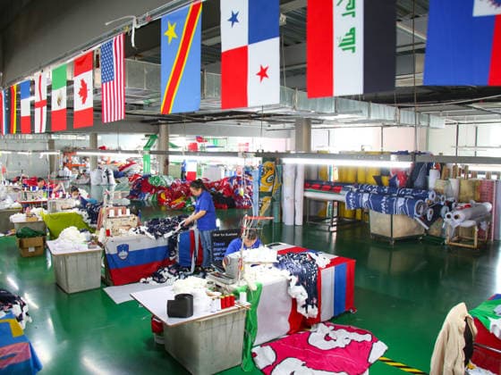 QINGDAO, CHINA - MAY 28: Workers are busy in front of an assembly line of flags for the FIFA World Cup at Qingdao Wonderful Flag Industry Co on May 28, 2026 in Qingdao, Shandong Province of China. As the 2026 FIFA World Cup is around the corner, production lines at a flag manufacturer in Qingdao, Shandong province, are running at full speed to produce various types of flags, many of which will soon appear in stadiums across North America.  Copyright: xVCGx 111644648667