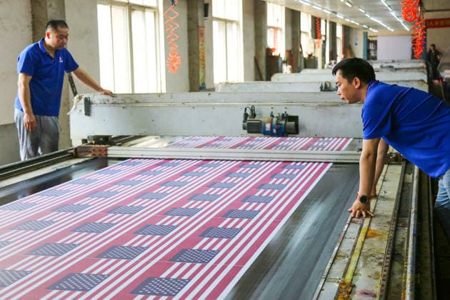 QINGDAO, CHINA - MAY 28: Workers are busy in front of an assembly line of flags for the FIFA World Cup at Qingdao Wonderful Flag Industry Co on May 28, 2026 in Qingdao, Shandong Province of China. As the 2026 FIFA World Cup is around the corner, production lines at a flag manufacturer in Qingdao, Shandong province, are running at full speed to produce various types of flags, many of which will soon appear in stadiums across North America.  Copyright: xVCGx 111644648651