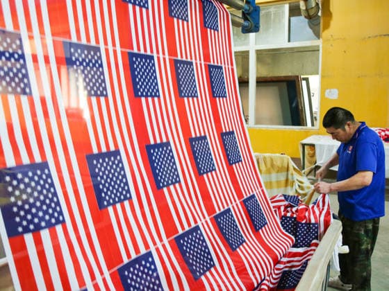 QINGDAO, CHINA - MAY 28: Workers are busy in front of an assembly line of flags for the FIFA World Cup at Qingdao Wonderful Flag Industry Co on May 28, 2026 in Qingdao, Shandong Province of China. As the 2026 FIFA World Cup is around the corner, production lines at a flag manufacturer in Qingdao, Shandong province, are running at full speed to produce various types of flags, many of which will soon appear in stadiums across North America.  Copyright: xVCGx 111644648652