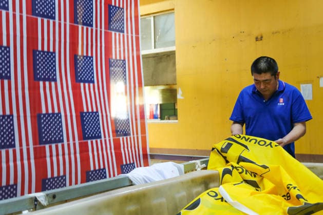 QINGDAO, CHINA - MAY 28: Workers are busy in front of an assembly line of flags for the FIFA World Cup at Qingdao Wonderful Flag Industry Co on May 28, 2026 in Qingdao, Shandong Province of China. As the 2026 FIFA World Cup is around the corner, production lines at a flag manufacturer in Qingdao, Shandong province, are running at full speed to produce various types of flags, many of which will soon appear in stadiums across North America.  Copyright: xVCGx 111644648653