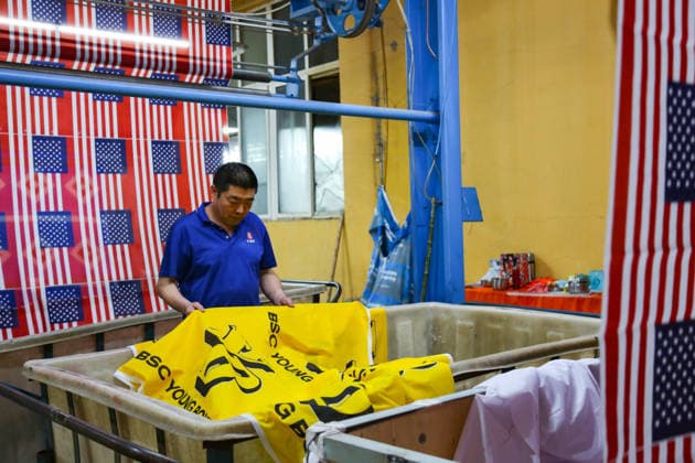 QINGDAO, CHINA - MAY 28: Workers are busy in front of an assembly line of flags for the FIFA World Cup at Qingdao Wonderful Flag Industry Co on May 28, 2026 in Qingdao, Shandong Province of China. As the 2026 FIFA World Cup is around the corner, production lines at a flag manufacturer in Qingdao, Shandong province, are running at full speed to produce various types of flags, many of which will soon appear in stadiums across North America.  Copyright: xVCGx 111644648654