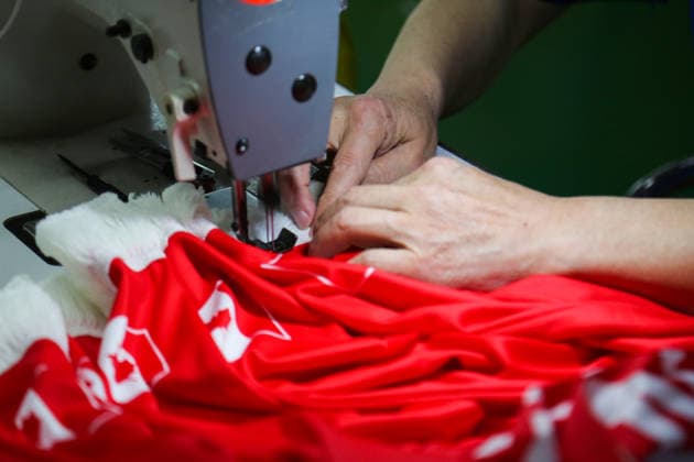 QINGDAO, CHINA - MAY 28: Workers are busy in front of an assembly line of flags for the FIFA World Cup at Qingdao Wonderful Flag Industry Co on May 28, 2026 in Qingdao, Shandong Province of China. As the 2026 FIFA World Cup is around the corner, production lines at a flag manufacturer in Qingdao, Shandong province, are running at full speed to produce various types of flags, many of which will soon appear in stadiums across North America.  Copyright: xVCGx 111644648656