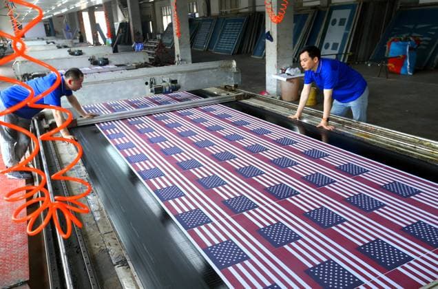 QINGDAO, CHINA - MAY 28: Workers are busy in front of an assembly line of flags for the FIFA World Cup at Qingdao Wonderful Flag Industry Co on May 28, 2026 in Qingdao, Shandong Province of China. As the 2026 FIFA World Cup is around the corner, production lines at a flag manufacturer in Qingdao, Shandong province, are running at full speed to produce various types of flags, many of which will soon appear in stadiums across North America.  Copyright: xVCGx 111644611654