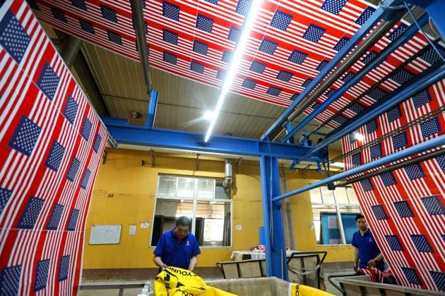 QINGDAO, CHINA - MAY 28: Workers are busy in front of an assembly line of flags for the FIFA World Cup at Qingdao Wonderful Flag Industry Co on May 28, 2026 in Qingdao, Shandong Province of China. As the 2026 FIFA World Cup is around the corner, production lines at a flag manufacturer in Qingdao, Shandong province, are running at full speed to produce various types of flags, many of which will soon appear in stadiums across North America.  Copyright: xVCGx 111644611656