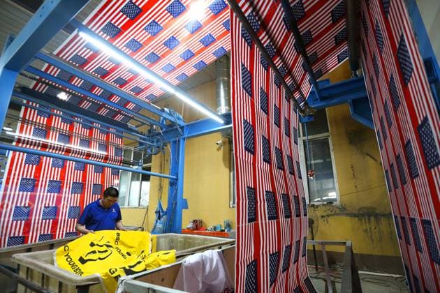 QINGDAO, CHINA - MAY 28: Workers are busy in front of an assembly line of flags for the FIFA World Cup at Qingdao Wonderful Flag Industry Co on May 28, 2026 in Qingdao, Shandong Province of China. As the 2026 FIFA World Cup is around the corner, production lines at a flag manufacturer in Qingdao, Shandong province, are running at full speed to produce various types of flags, many of which will soon appear in stadiums across North America.  Copyright: xVCGx 111644611657