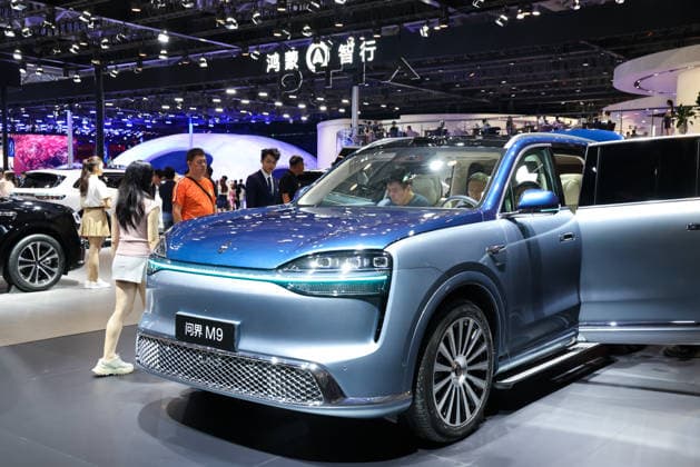 (260529) -- SHENZHEN, May 29, 2026 -- Visitors experience an AITO M9 SUV on display during the Guangdong-Hong Kong-Macao Greater Bay Area (GBA) Auto Show 2026 in Shenzhen, south China s Guangdong Province, on May 29, 2026. The Guangdong-Hong Kong-Macao Greater Bay Area (GBA) Auto Show 2026 kicked off at Shenzhen World Exhibition & Convention Center on Friday. Themed with Focus on Technology, Future and Market, the show features over 100 brands and over 1,300 models, and runs till June 7. ) CHINA-GUANGDONG-SHENZHEN-GBA AUTO SHOW 2026 (CN) LiangxXu 