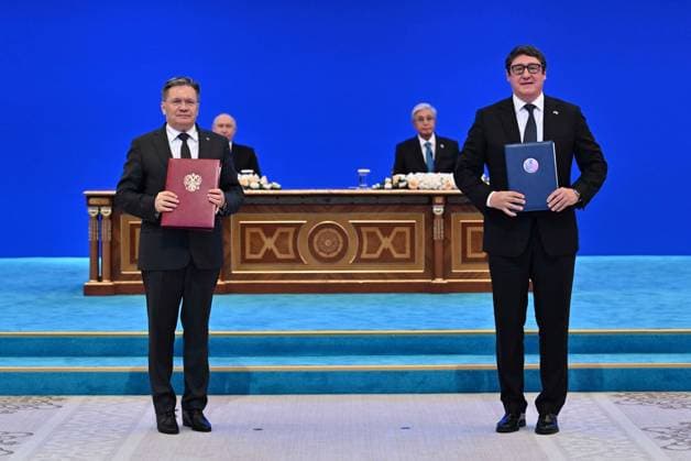 (260529) -- ASTANA, May 29, 2026 -- Representatives of Kazakhstan and Russia exchange an agreement on the construction of a nuclear power plant in Astana, Kazakhstan, on May 28, 2026. Kazakhstan and Russia on Thursday signed an agreement outlining the terms of cooperation for the construction of Kazakhstan s first nuclear power plant, including a state export credit to finance the bulk of the project, Kazinform news agency reported. Russian President Vladimir Putin arrived in Kazakhstan s capital Astana on Wednesday for a state visit and to attend the meeting of the Supreme Eurasian Economic Council and the Eurasian Economic Forum through May 29. (Kazakhstan s presidential press service Handout via Xinhua) KAZAKHSTAN-ASTANA-RUSSIA-NUCLE 