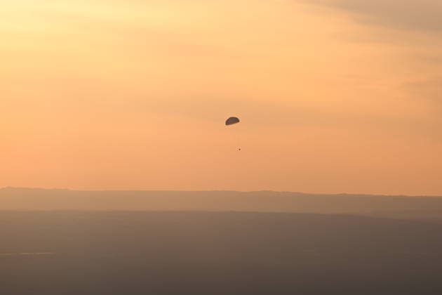 (260529) -- JIUQUAN, May 29, 2026 -- The return capsule of the Shenzhou-22 spaceship, carrying the Shenzhou-21 astronauts Zhang Lu, Wu Fei and Zhang Hongzhang, is about to touch down at the Dongfeng landing site in north China s Inner Mongolia Autonomous Region, on May 29, 2026. The return capsule of the Shenzhou-22 spaceship, carrying the Shenzhou-21 astronauts Zhang Lu, Wu Fei and Zhang Hongzhang, touched down at the Dongfeng landing site on Friday. The three astronauts are all in good health condition, the China Manned Space Agency said, noting that the Shenzhou-21 spaceflight mission is a complete success. ) FOCUS Shenzhou-22 return capsule touches down, astronauts all sound LixZhipeng 