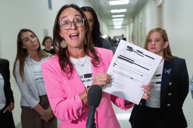Lauren Hersh, Founding Co-Chair and National Director of World Without Exploitation, holds a redacted Epstein Files document as she gives remarks to the media outside of a closed-door House Oversight Committee hearing in the Rayburn House Office Building near the U.S. Capitol in Washington, DC on Friday, May 29, 2026. Former Attorney General Pam Bondi is delivering closed testimony on the Department of Justice s handling of the Jeffrey Epstein files.  WAP2026052906730 AARONxSCHWARTZ