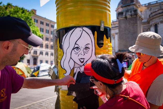 May 30, 2026, Rome, Rm, Italy: Extinction Rebellion activists are launching a 24-hour rally in Piazza dell Esquilino, just days before the 80th anniversary of the Italian Republic on June 2nd. They say: there is nothing to celebrate as long as rights, justice, and dignity continue to be denied. Oil extraction is imposed through violence and war to produce ever more energy, further increasing inequality. Activists pin drawings of Donald Trump and Giorgia Meloni to a rocket made of oil drums. It reads: Fascists on Mars. Rome Italy  - ZUMAg256 20260530_znp_g256_008 Copyright: xMarcoxDixGianvitox
