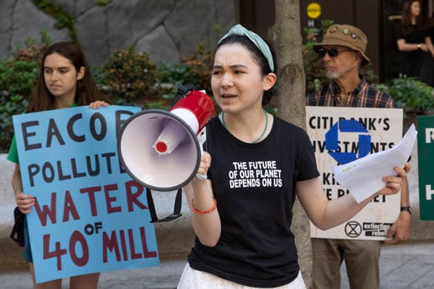 May 29, 2026, New York, New York, USA: Climate activists protesting Chase bankÃ¢â‚¬â ¢s support of Total EnergiesÃ¢â‚¬â ¢ East African Crude Oil Pipeline (EACOP) rally and blockade entrances to JP Morgan Chase headquarters in Midtown Manhattan before blocking traffic on Park Avenue outside the building, resulting in arrests by NYPD. Teenage climate activist AVERY TSAI speaks at the rally wearing a shirt that reads THE FUTURE OF OUR PLANET DEPENDS ON US. Demonstrators join the Kick Polluters Out Global Week of Action denouncing the pipeline for causing displacement of farmers in Uganda and Tanzania and damage to protected waterways, biodiversity areas and ecosystems. Organizations involved in the protest include Planet Over Profit, Extin  - ZUMAr174 20260529_znp_r174_024 Copyright: xGinaxMxRandazzox