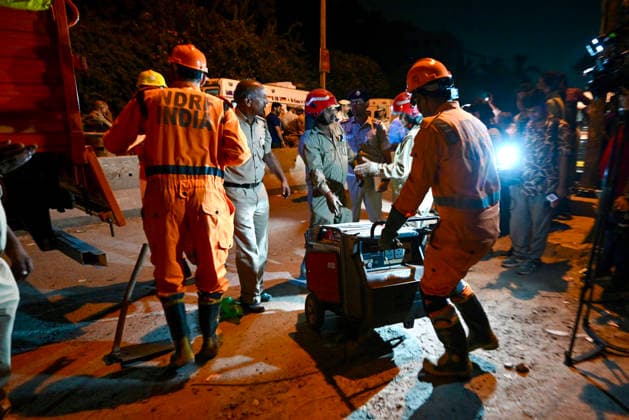 NEW DELHI, INDIA - MAY 30: Rescue personnel carry out rescue operations at the site of a five-storey building collapse on Westend Marg in Saidulajab, South Delhi, on May 30, 2026 in New Delhi, India. Several people are feared trapped under the rubble. The building housed a coaching institute on the ground floor. Construction work was ongoing on upper floors. Rescue operations are underway. Fire tenders and police are at the scene. Locals are assisting in the search efforts. (Photo by Raj K Raj Hindustan Times ) Multi-Storey Building Collapses In Delhi™s Saket; Several Feared Trapped
