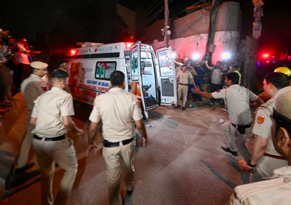 NEW DELHI, INDIA - MAY 30: Rescue personnel shift an injured person to an ambulance after a five-storey building collapsed on Westend Marg in Saidulajab, South Delhi, on May 30, 2026 in New Delhi, India. Several people are feared trapped under the rubble. The building housed a coaching institute on the ground floor. Construction work was ongoing on upper floors. Rescue operations are underway. Fire tenders and police are at the scene. Locals are assisting in the search efforts. (Photo by Raj K Raj Hindustan Times ) Multi-Storey Building Collapses In Delhi™s Saket; Several Feared Trapped