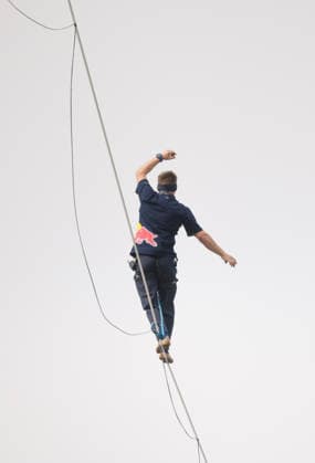 Slackliner walks between two tallest building in Warsaw Photo: Dawid Wolski East News Estonian slackliner Jaan Roose attempts to walk the highline between two tallest buildings in the Polish capital during the Red Bull Line of Time over Warsaw event on May 31, 2026 in Warsaw, Poland. The 500-meter-long slackline is stretched between the communist era, Soviet designed Palace of Culture and Science and recently constructed, designed by Foster and Partners Varso Tower at 180 meters above street level. EN_01678444_0032 