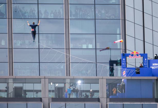 Slackliner walks between two tallest building in Warsaw Photo: Dawid Wolski East News Estonian slackliner Jaan Roose attempts to walk the highline between two tallest buildings in the Polish capital during the Red Bull Line of Time over Warsaw event on May 31, 2026 in Warsaw, Poland. The 500-meter-long slackline is stretched between the communist era, Soviet designed Palace of Culture and Science and recently constructed, designed by Foster and Partners Varso Tower at 180 meters above street level. EN_01678444_0047 