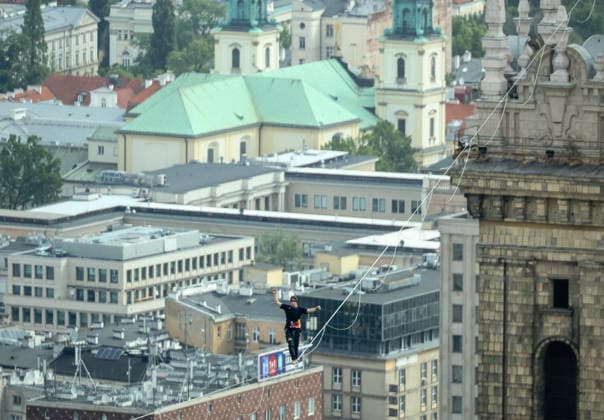 Slackliner walks between two tallest building in Warsaw Photo: Adam Burakowski East News Estonian slackliner Jaan Roose attempts to walk the highline between two tallest buildings in the Polish capital during the Red Bull Line of Time over Warsaw event on May 31, 2026 in Warsaw, Poland. The 500-meter-long slackline is stretched between the communist era, Soviet designed Palace of Culture and Science and recently constructed, designed by Foster and Partners Varso Tower at 180 meters above street level. EN_01678444_0065 