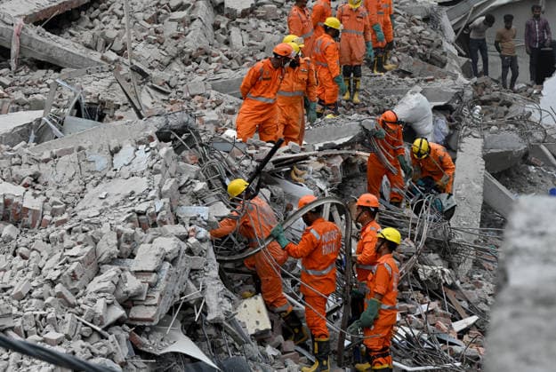NEW DELHI, INDIA - MAY 31: NDRF team conducts rescue operations at the site of a five-storey building collapse on Westend Marg in Saidulajab, South Delhi, on May 31, 2026 in New Delhi, India. A rescue operation was conducted overnight to pull survivors out of the debris as authorities continue search efforts in the hope of pulling out more people. This is a multi-agency rescue operation, including teams from the National Disaster Response Force (NDRF), Delhi Fire Services (DFS), Delhi Police, Delhi Disaster Management Authority (DDMA), Municipal Corporation of Delhi (MCD), Civil Defence and CATS Ambulance Service. Heavy machinery, hydraulic cutters, victim-location cameras and sniffer dogs were used by the rescue operation teams to maximise