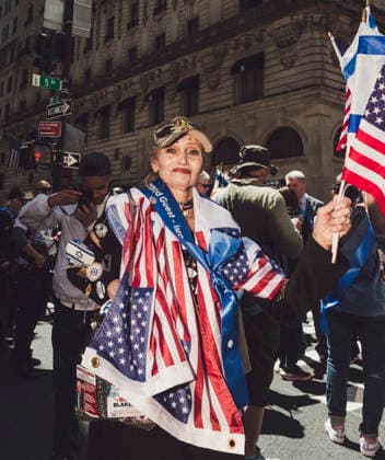 May 31, 2026, New York, New York, USA: A woman draped in an American Flag and carrying both an Israeli and American flag, awaits for the annual Israel Day Parade to begin in Manhattan. New York USA  - ZUMAp287 20260531_znp_p287_001 Copyright: xFarhadxParsax