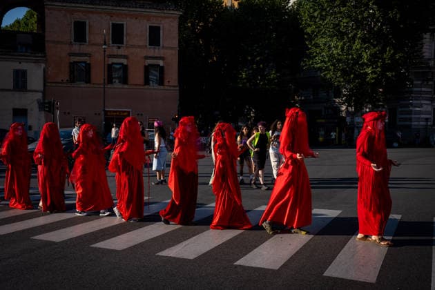 May 31, 2026, Rome, Rm, Italy: A few days before the 80th anniversary of the Italian Republic on June 2nd, the action of Red Rebels Brigade, in front of San Giovanni Basilica, expresses the deep sorrow for the victims of war and the climate crisis, showing their anger toward the government that finances both with its policies. The Red Rebels are a symbol of hope for a world where violence does not reign, but rather peace and harmony with the earth. Rome Italy  - ZUMAg256 20260531_znp_g256_042 Copyright: xMarcoxDixGianvitox