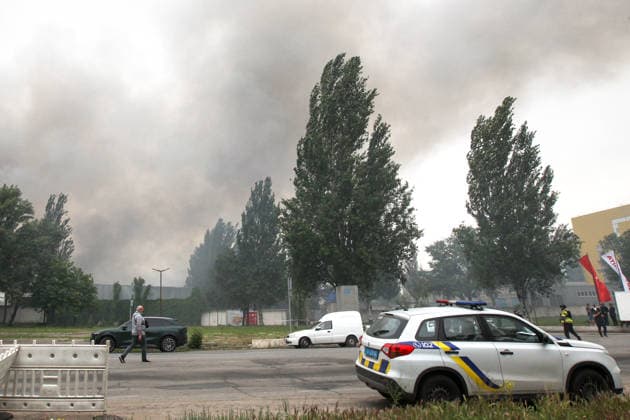 Smoke rises from burning Nova Poshta Branch No. 1, destroyed by a Russian drone strike, Dnipro, Ukraine, on May 31, 2026. The strike destroyed the branch completely, with the building burning down. Cars parked nearby were also damaged. (Photo by Mykola Miakshykov Ukrinform) Russian drone attack destroys post branch in Dnipro  Copyright: xMykolaxMiakshykovx