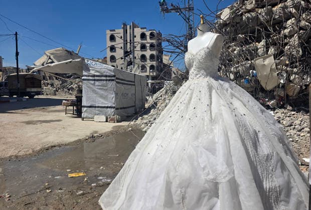 Customers browse wedding attire in Khan Younis despite wartime hardships Customers browse wedding dresses and suits inside a bridal shop in Khan Younis in the southern Gaza Strip on June 1, 2026, as Palestinians continue to uphold marriage traditions despite the ongoing war, widespread destruction, and difficult economic and humanitarian conditions. Shop owners say demand for wedding supplies remains present, though at a lower pace, as many families turn to less costly options amid declining incomes, rising prices, and shortages of goods linked to Israeli restrictions at border crossings. Photo by Tariq Mohammad APA Images Khan Yunis Gaza Strip Palestinian Territory 010626_Khan_Yunis_TM_00(1) Copyright: xapaimagesxTariqxMohammad xapaimagesx