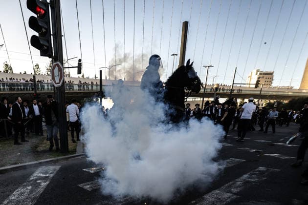 Ultra-Orthodox Jews protest mandatory military service in Jerusalem JERUSALEM - JUNE 1: Israeli police use stun grenades and mounted units to disperse ultra-Orthodox Jewish (Haredi) demonstrators protesting the detention of draft resisters and mandatory military service in West Jerusalem on June 1, 2026. Gathering at the Hamitarim Bridge, a major junction in the city, protesters condemned the arrest of nine Haredi men in Beit Shemesh a day earlier and blocked traffic, causing major disruptions before police moved to clear the roadway. Mostafa Alkharouf Anadolu Jerusalem Israel. Editorial use only. Please get in touch for any other usage.  Copyright: x2026xAnadoluxMostafaxAlkharoufx