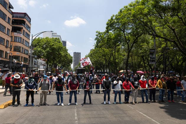 June 1, 2026, Mexico City, Mexico: Members of the National Coordinator of Education Workers (CNTE) marched toward downtown Mexico City as part of the national teachers strike and the indefinite encampment they maintain in the Mexican capital while demanding improved labor conditions. During the protest, CNTE teachers clashed with officers of the Mexico City Citizen Security Secretariat (SSC) after attempting to remove barriers that prevented them from reaching the Zocalo. Mexico City Mexico  - ZUMAl178 20260601_znp_l178_017 Copyright: xCristianxLeyvax