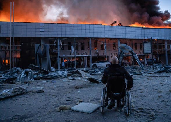 June 2, 2026, Kyiv, Ukraine: A man in front of a burning building damaged during a large Russian missile and drone attack in Kyiv. Kyiv Ukraine  - ZUMAs197 20260602_aaa_s197_014 Copyright: xPatrykxJaraczx