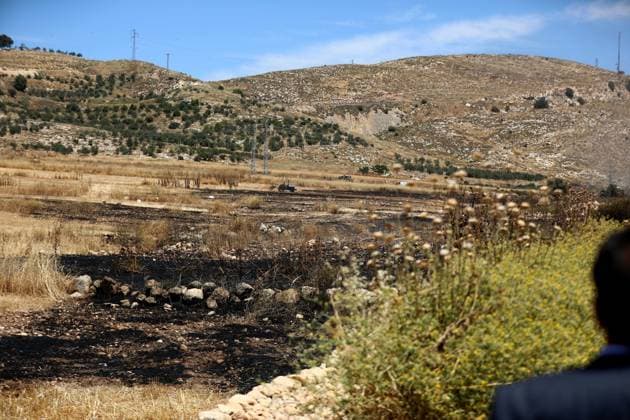 Israelis set fire to wheat fields in the West Bank HEBRON, WEST BANK, PALESTINE - JUNE 2: Israeli soldiers who arrived at the scene blocked the road and intervened against Palestinians trying to extinguish the fire as they set fire to large areas of wheat fields in the town of Izna, in Hebron, West Bank, Palestine, on June 2, 2026. Wisam Hashlamoun Anadolu Hebron West Bank. Editorial use only. Please get in touch for any other usage.  Copyright: x2026xAnadoluxWisamxHashlamounx