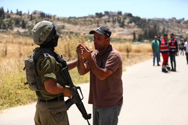 Israelis set fire to wheat fields in the West Bank HEBRON, WEST BANK, PALESTINE - JUNE 2: Israeli soldiers who arrived at the scene blocked the road and intervened against Palestinians trying to extinguish the fire as they set fire to large areas of wheat fields in the town of Izna, in Hebron, West Bank, Palestine, on June 2, 2026. Wisam Hashlamoun Anadolu Hebron West Bank. Editorial use only. Please get in touch for any other usage.  Copyright: x2026xAnadoluxWisamxHashlamounx