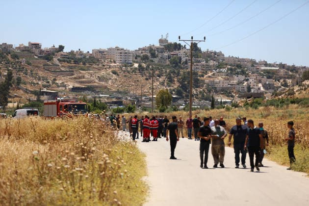 Israelis set fire to wheat fields in the West Bank HEBRON, WEST BANK, PALESTINE - JUNE 2: Emergency services arrive the area where Israeli soldiers who arrived at the scene blocked the road and intervened against Palestinians trying to extinguish the fire as they set fire to large areas of wheat fields in the town of Izna, in Hebron, West Bank, Palestine, on June 2, 2026. Wisam Hashlamoun Anadolu Hebron West Bank. Editorial use only. Please get in touch for any other usage.  Copyright: x2026xAnadoluxWisamxHashlamounx