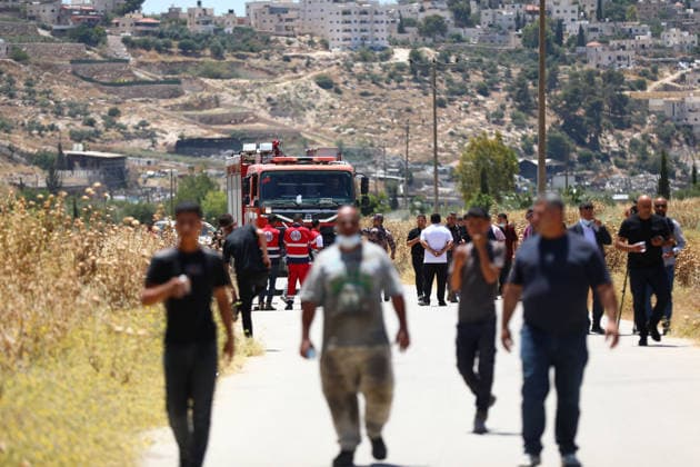 Israelis set fire to wheat fields in the West Bank HEBRON, WEST BANK, PALESTINE - JUNE 2: Emergency services arrive the area where Israeli soldiers who arrived at the scene blocked the road and intervened against Palestinians trying to extinguish the fire as they set fire to large areas of wheat fields in the town of Izna, in Hebron, West Bank, Palestine, on June 2, 2026. Wisam Hashlamoun Anadolu Hebron West Bank. Editorial use only. Please get in touch for any other usage.  Copyright: x2026xAnadoluxWisamxHashlamounx