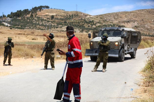 Israelis set fire to wheat fields in the West Bank HEBRON, WEST BANK, PALESTINE - JUNE 2: Israeli soldiers who arrived at the scene blocked the road and intervened against Palestinians trying to extinguish the fire as they set fire to large areas of wheat fields in the town of Izna, in Hebron, West Bank, Palestine, on June 2, 2026. Wisam Hashlamoun Anadolu Hebron West Bank. Editorial use only. Please get in touch for any other usage.  Copyright: x2026xAnadoluxWisamxHashlamounx