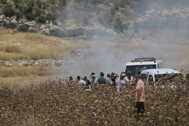 Palestinians gather near fire in agricultural land west of Hebron Palestinians and members of the Palestinian Civil Defense gather near the site of a fire on agricultural land around the village of Idhna, west of the West Bank city of Hebron, on June 2, 2026. Palestinian residents said Israeli settlers set fire to land in the area, while the Israeli army prevented residents from reaching it and intervened at the site. Photo by Mamoun Wazwaz apaimages Hebron West Bank Palestinian Territory 020626_Hebron_MW_00(1) Copyright: xapaimagesxMamounxWazwazx xapaimagesx